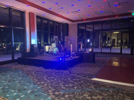 Vintage 4.0 stage and dance floor setup in a reception-style event space